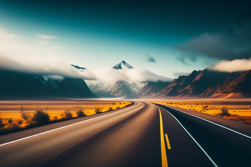 road-leading-mountains-with-blue-sky-clouds